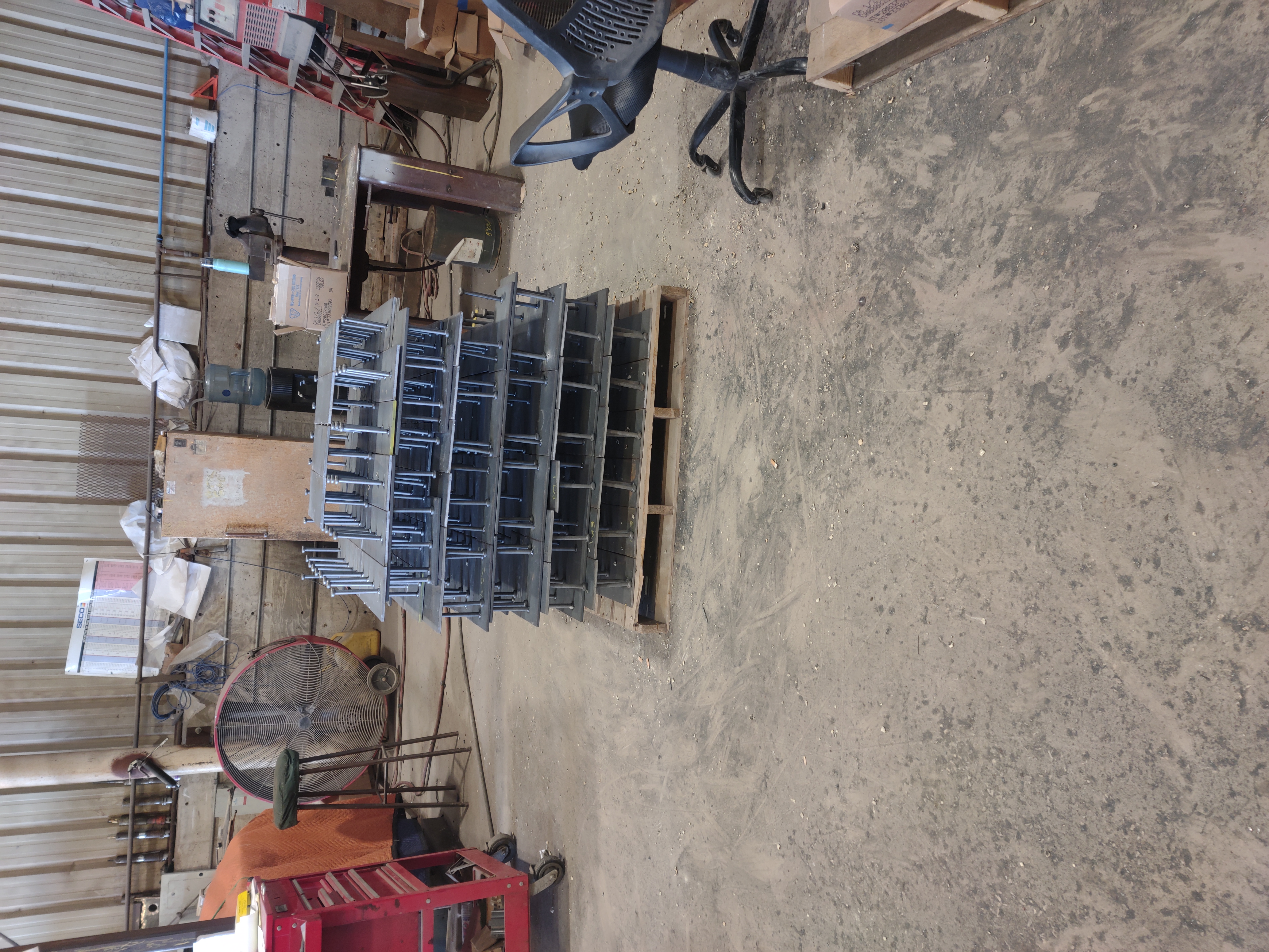 Pallet of steel plates with welded Nelson stud embeds, over one hundred units