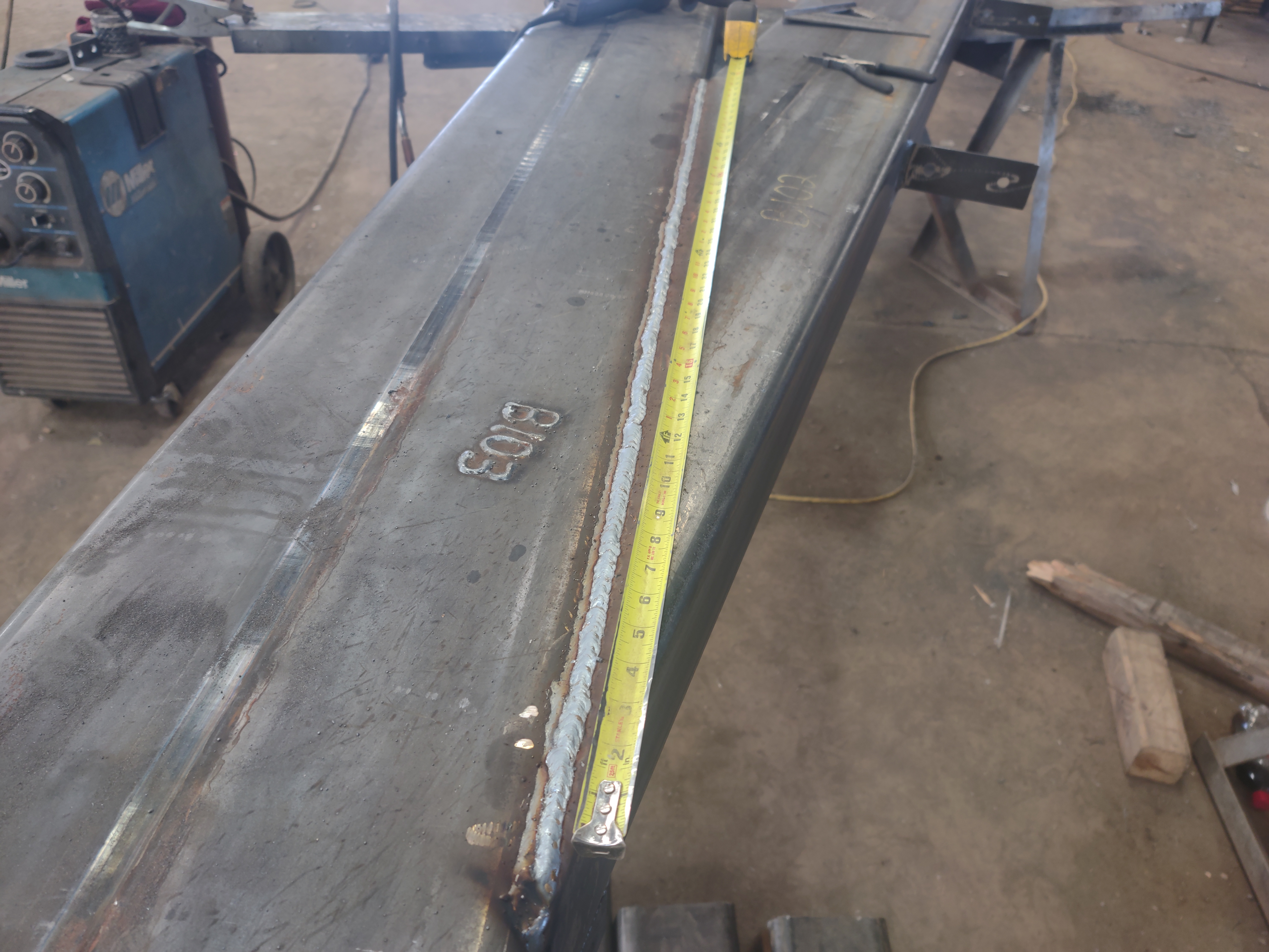 Long welded truss section with three stringer weld passes along its length